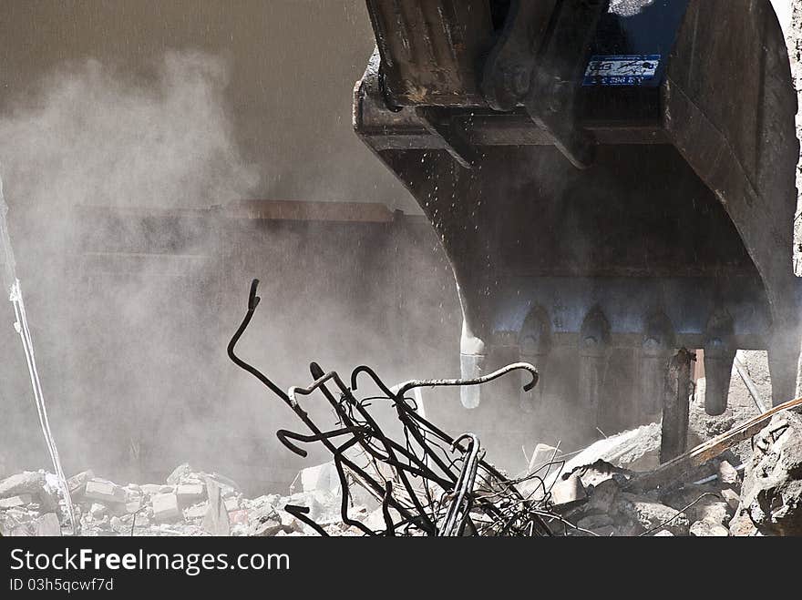 Indrustrial machine demolishing a building