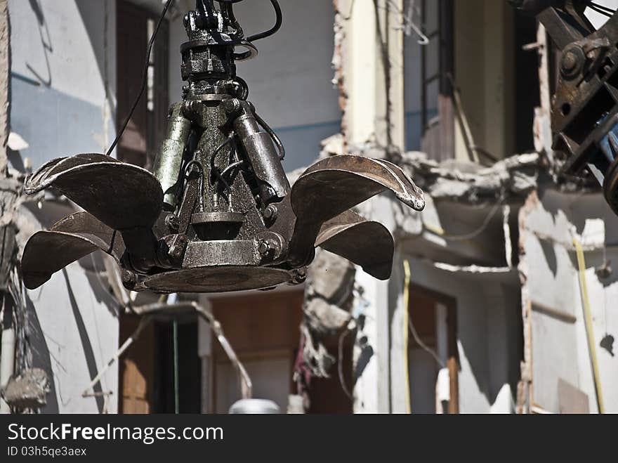 Indrustrial machine demolishing a building