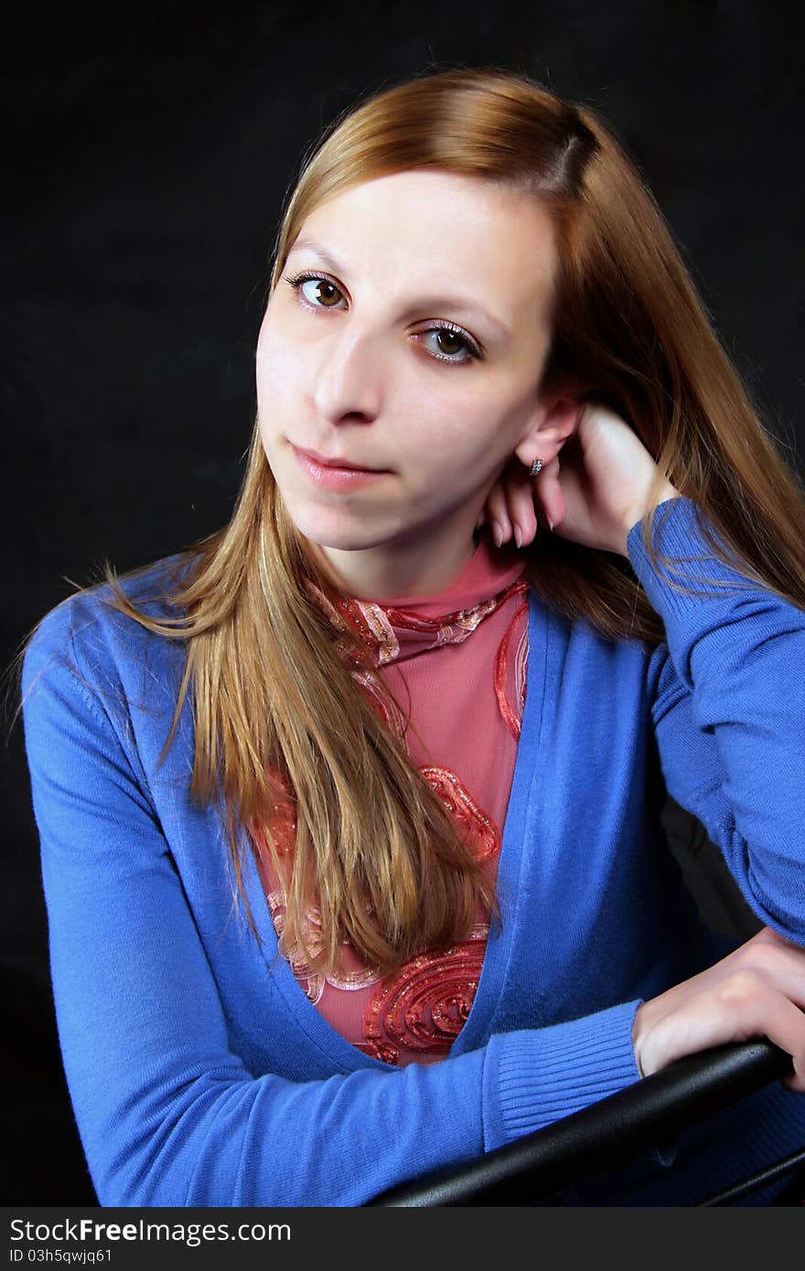 Portrait of the girl on a black background