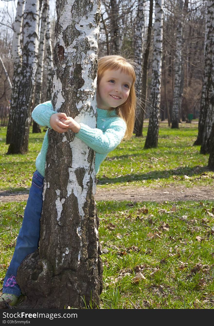 Smiling Girl In Birch Grove