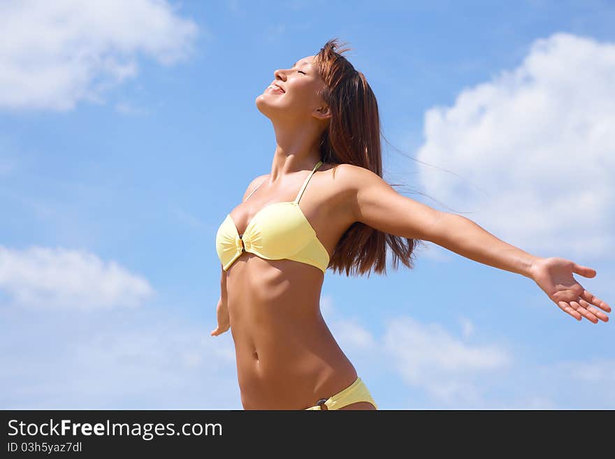 Portrait of young attractive woman having good time in the beach. Portrait of young attractive woman having good time in the beach