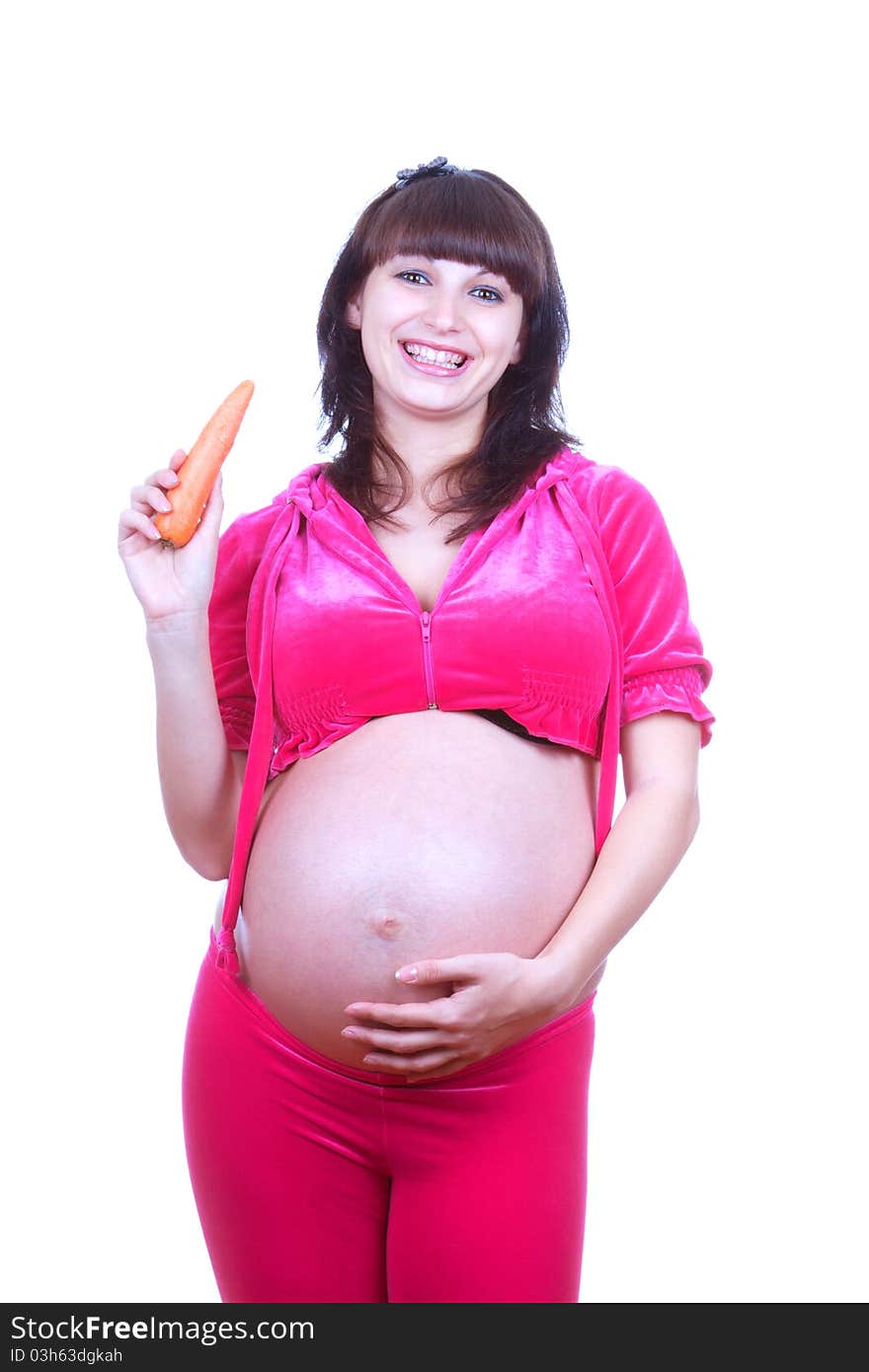 Pregnant woman with carrot isolated over white background