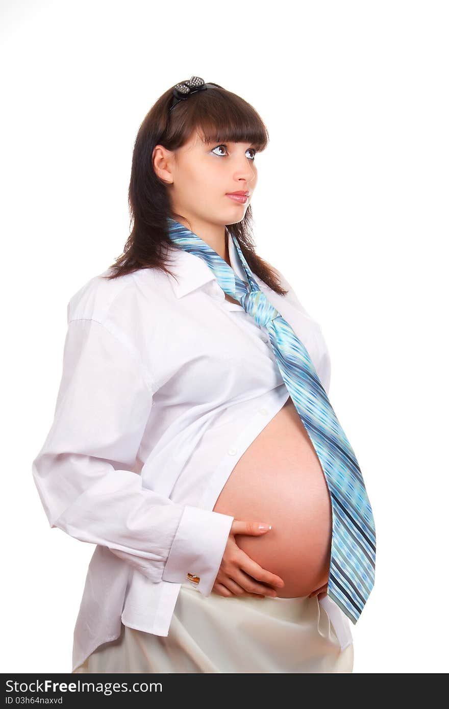 Pregnant businesswoman wearing a man's shirt and tie isolated over white background. Pregnant businesswoman wearing a man's shirt and tie isolated over white background