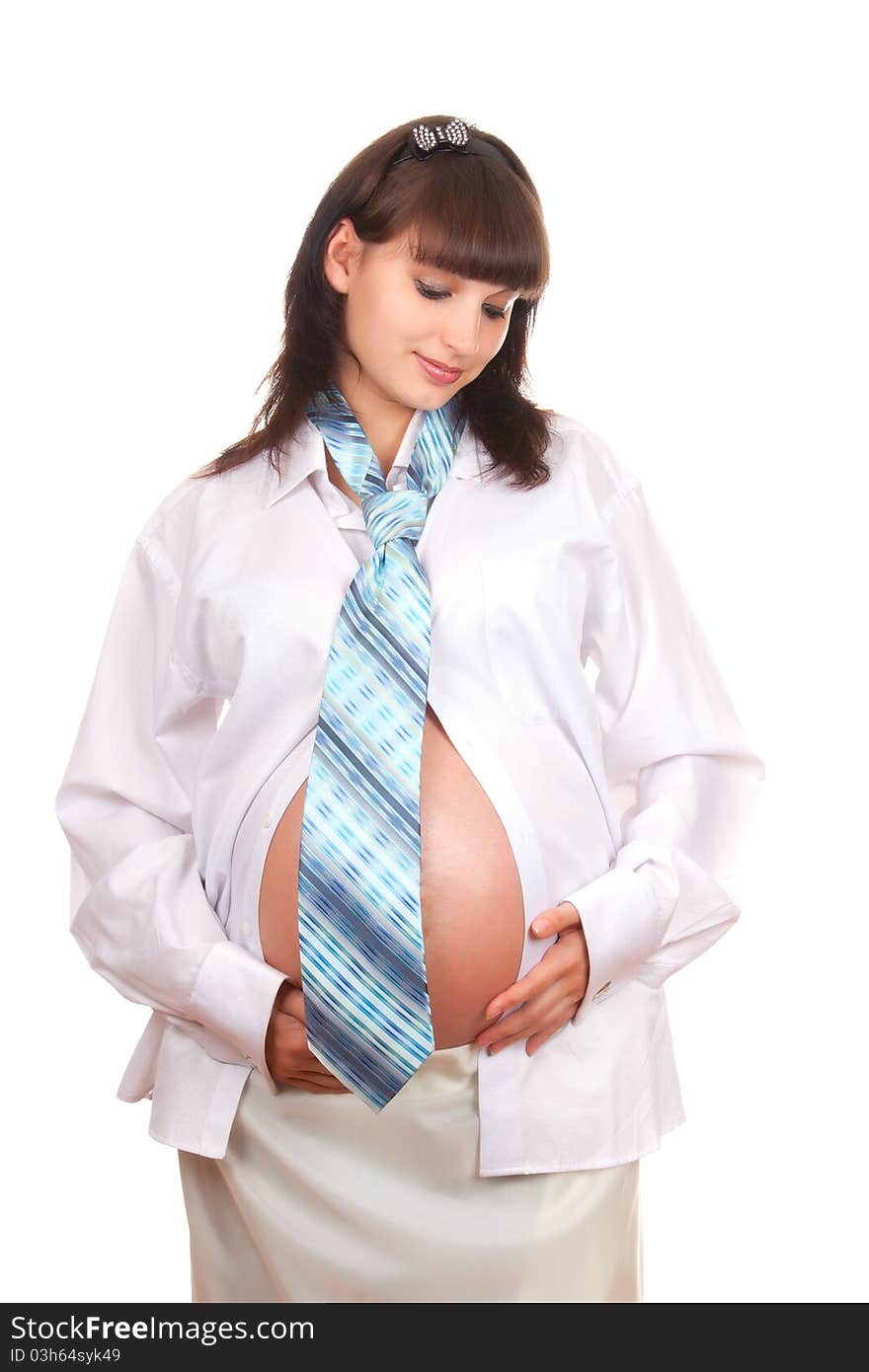 Pregnant businesswoman wearing a man's shirt and tie isolated over white background. Pregnant businesswoman wearing a man's shirt and tie isolated over white background