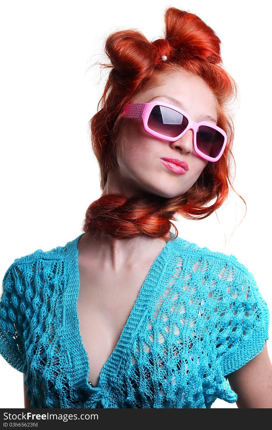 Fashion red-haired woman in a stylish glasses