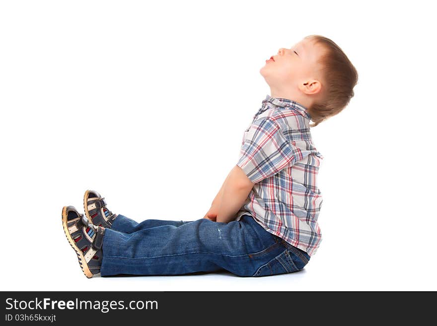 Cute little boy sitting look up to empty copy space isolated on white background. concept. Cute little boy sitting look up to empty copy space isolated on white background. concept.