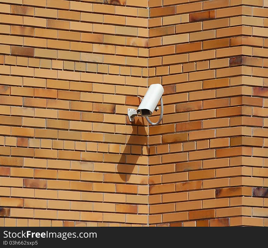 Security camera ower the brick wall