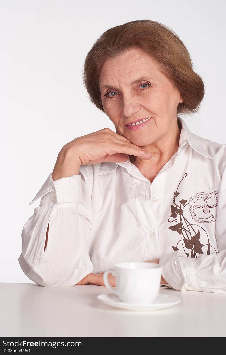 Beautiful elderly woman in a white clothes