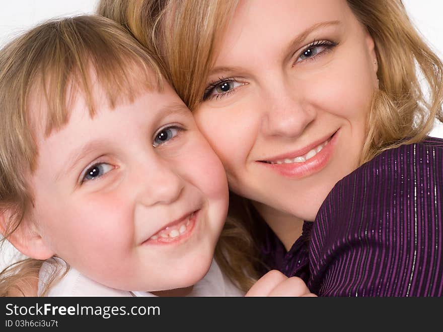 Happy mom with her daughter on a white background. Happy mom with her daughter on a white background