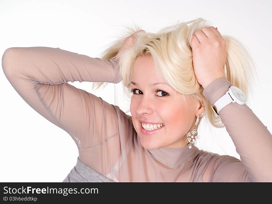 Wonderful girl in a grey clothes on a white background. Wonderful girl in a grey clothes on a white background