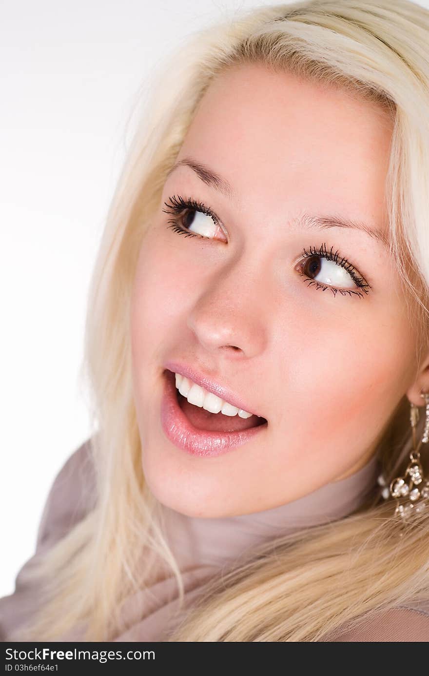 Wonderful girl in a grey clothes on a white background. Wonderful girl in a grey clothes on a white background