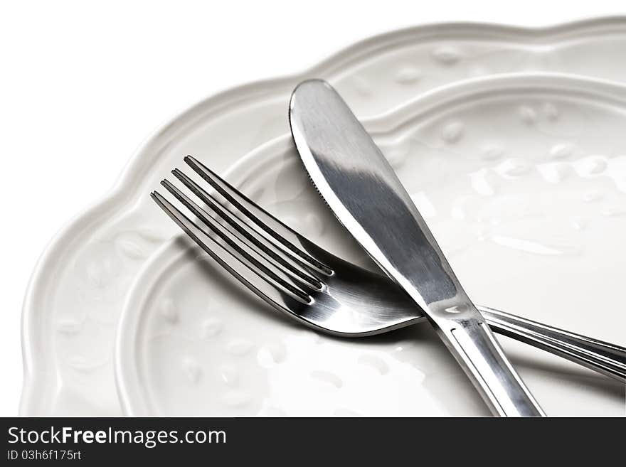 Dinner plates with knife and fork