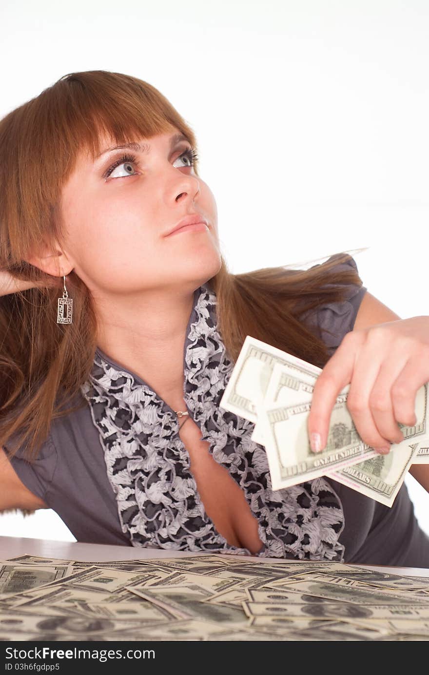 Pretty girl with cash on a white background