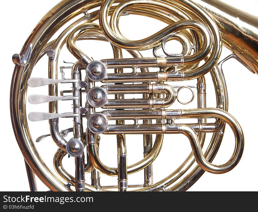 A concert french horn set against a white background. A concert french horn set against a white background