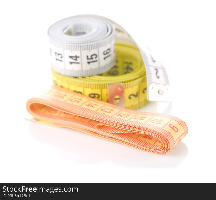 Studio shot of sewing composition
of measuring tapes isolated