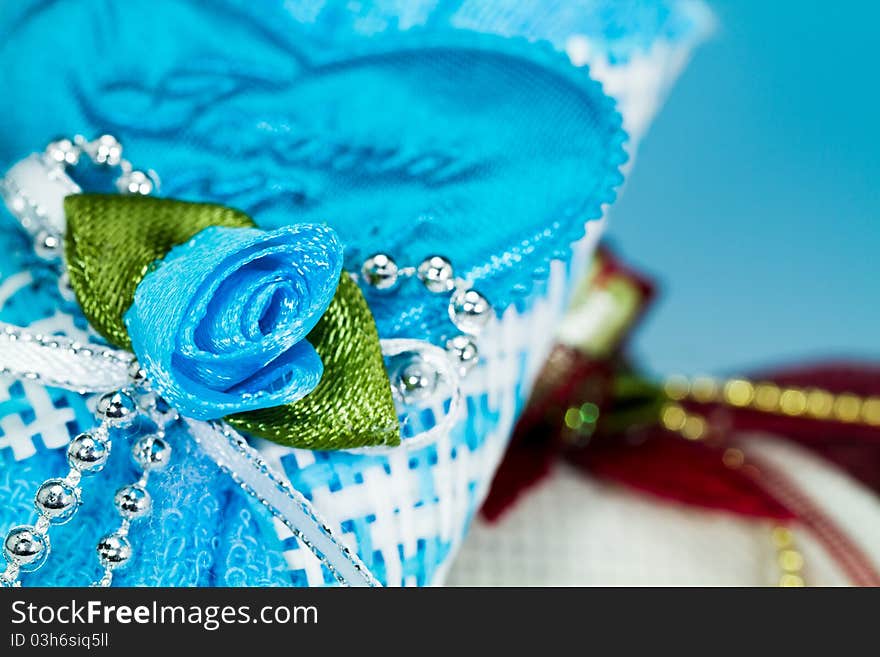 Close up of the blue ribbon rose on the door gift with blue background. Close up of the blue ribbon rose on the door gift with blue background