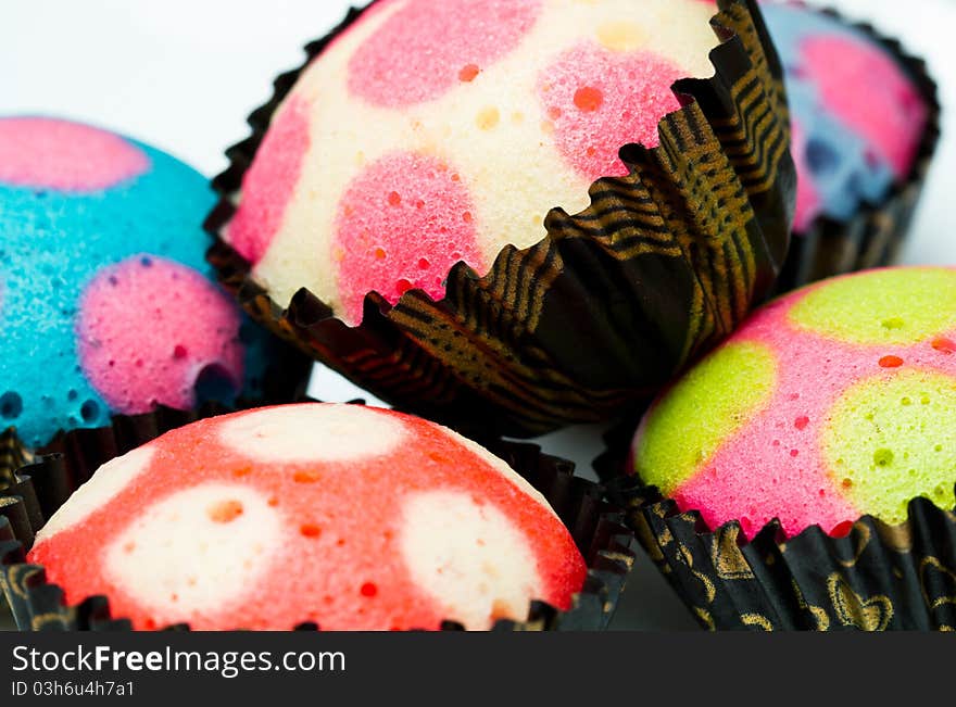 Delicious colorful cupcakes with white background. Delicious colorful cupcakes with white background