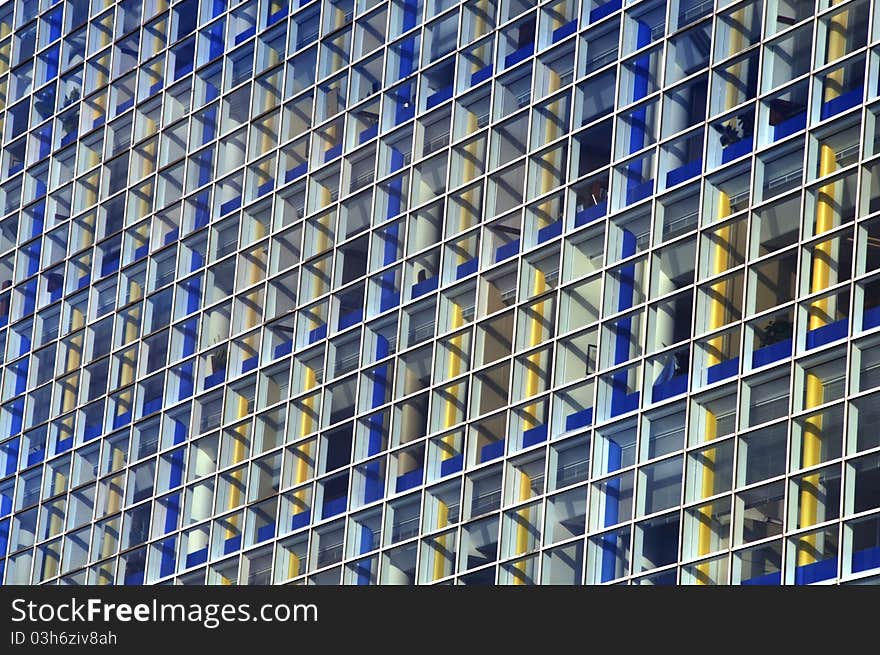 Colorful blue and yellow square windows of office building exterior. Colorful blue and yellow square windows of office building exterior