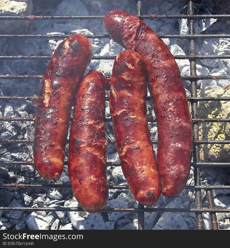 Tasty sausages on the grill