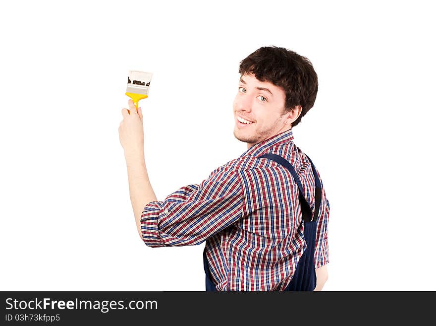 Happy housepainter painting, looking at camera & giving a beautiful smile