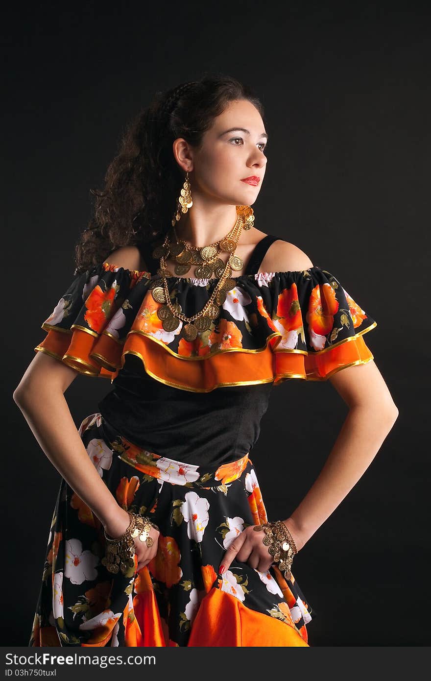 Young girl dance in gypsy costume