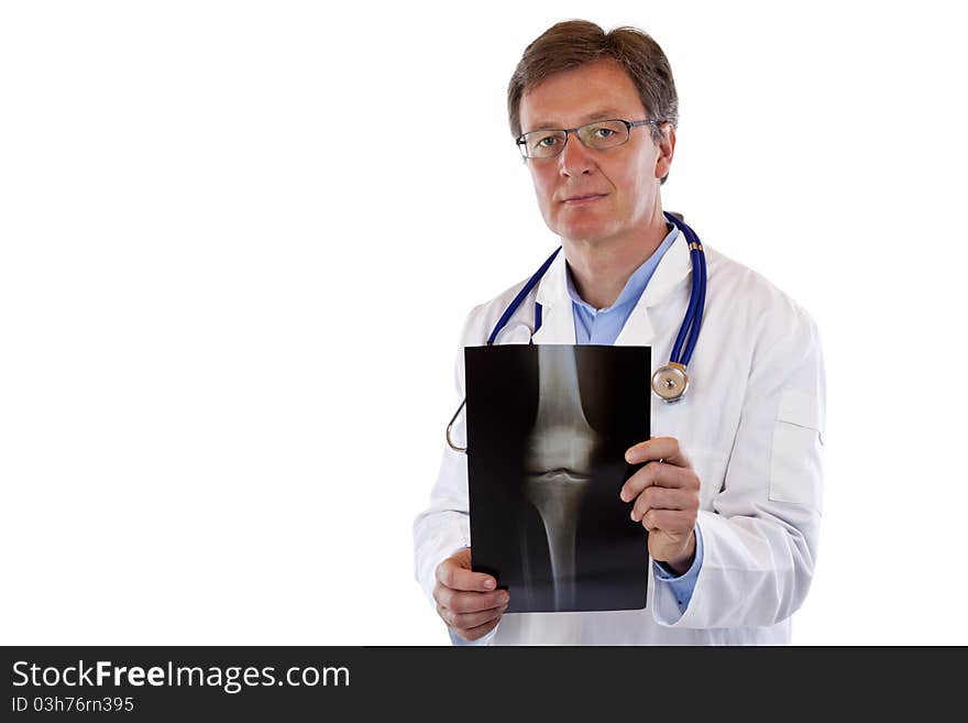 Friendly elderly doctor holds radiograph.Isolated on white background.