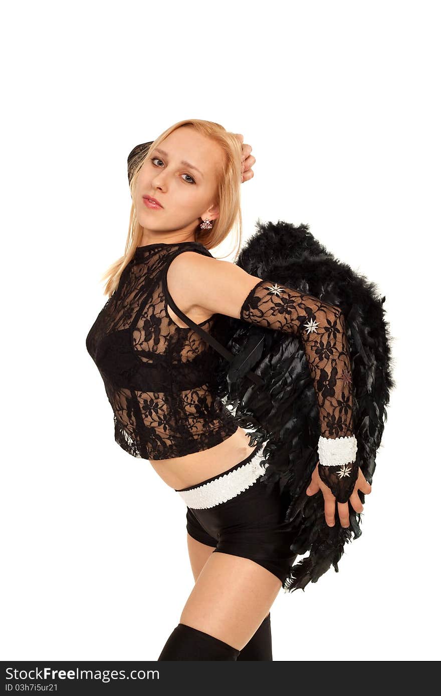 Model in costume of black angel posing for photo