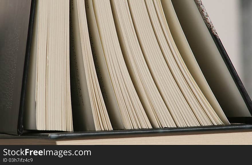 Thick open book pages and cover closeup