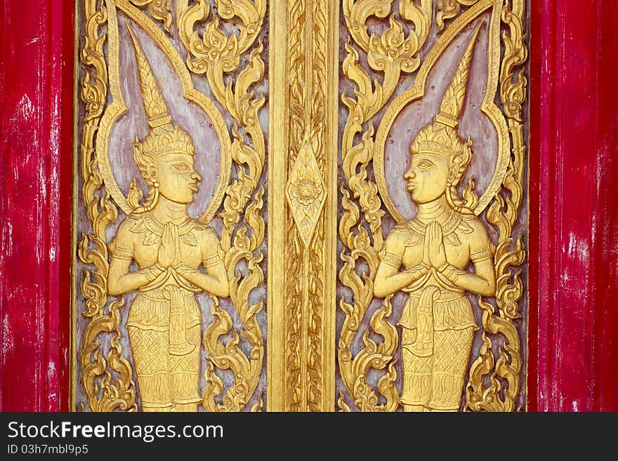 Thai temple doors carved with delicate beauty climaxed in Thai temples. Thai temple doors carved with delicate beauty climaxed in Thai temples.