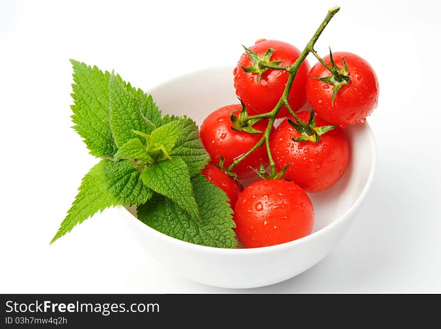 Basil and tomatoes in bowl