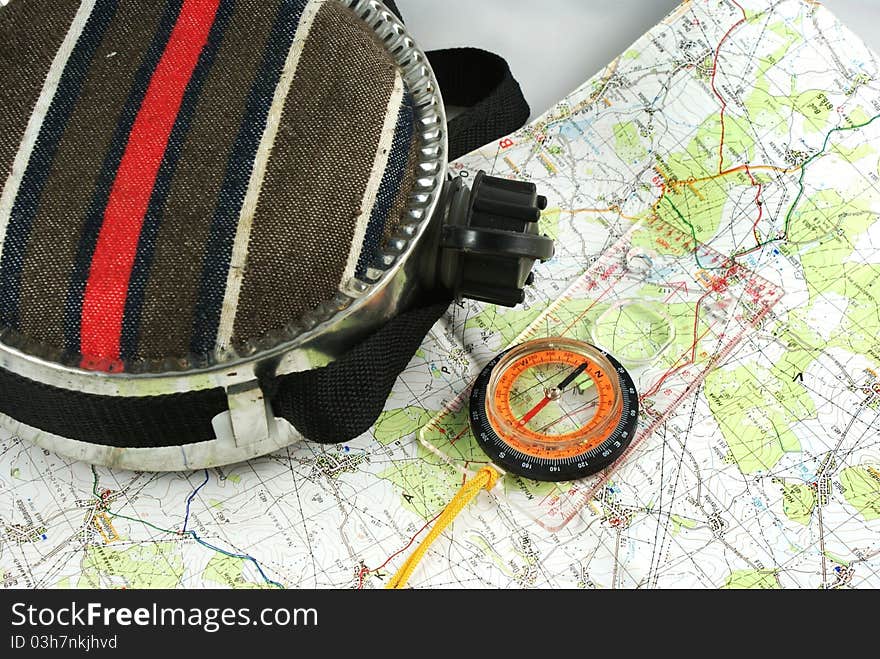 Bottle, magnetic compass and map. Bottle, magnetic compass and map