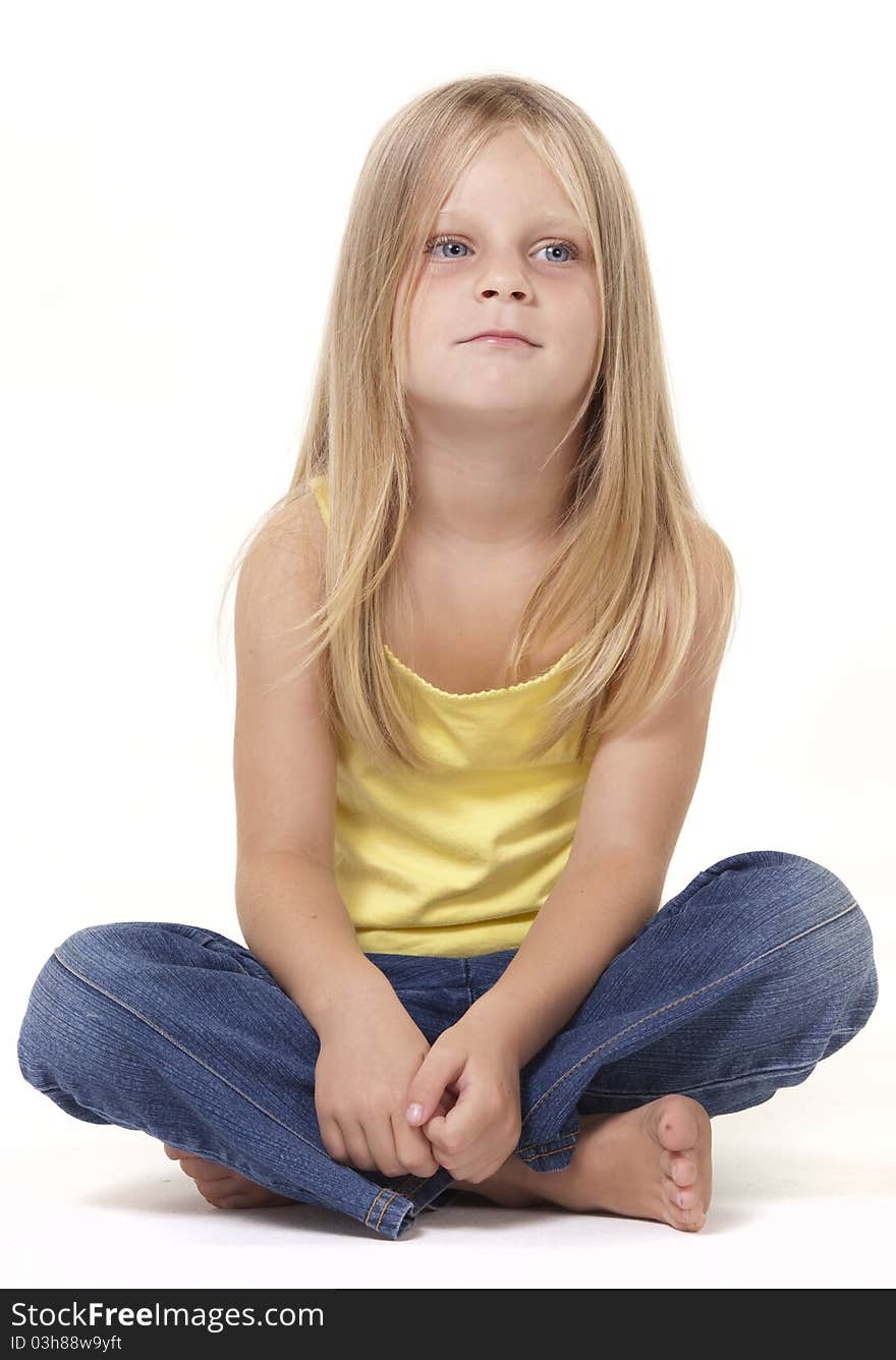 Young girl with a calm neutral, thoughtful expressiion. Young girl with a calm neutral, thoughtful expressiion.