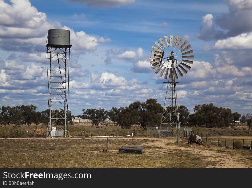 A typical scene in the Outback of a windmill and elevated water tank. A typical scene in the Outback of a windmill and elevated water tank