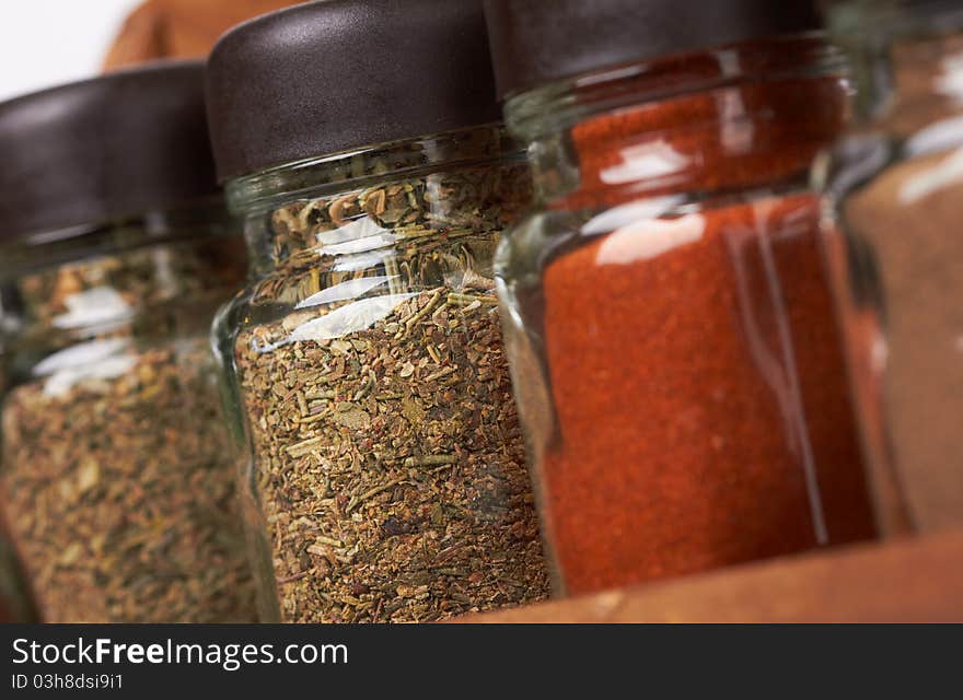 Set of spices in glass bottles