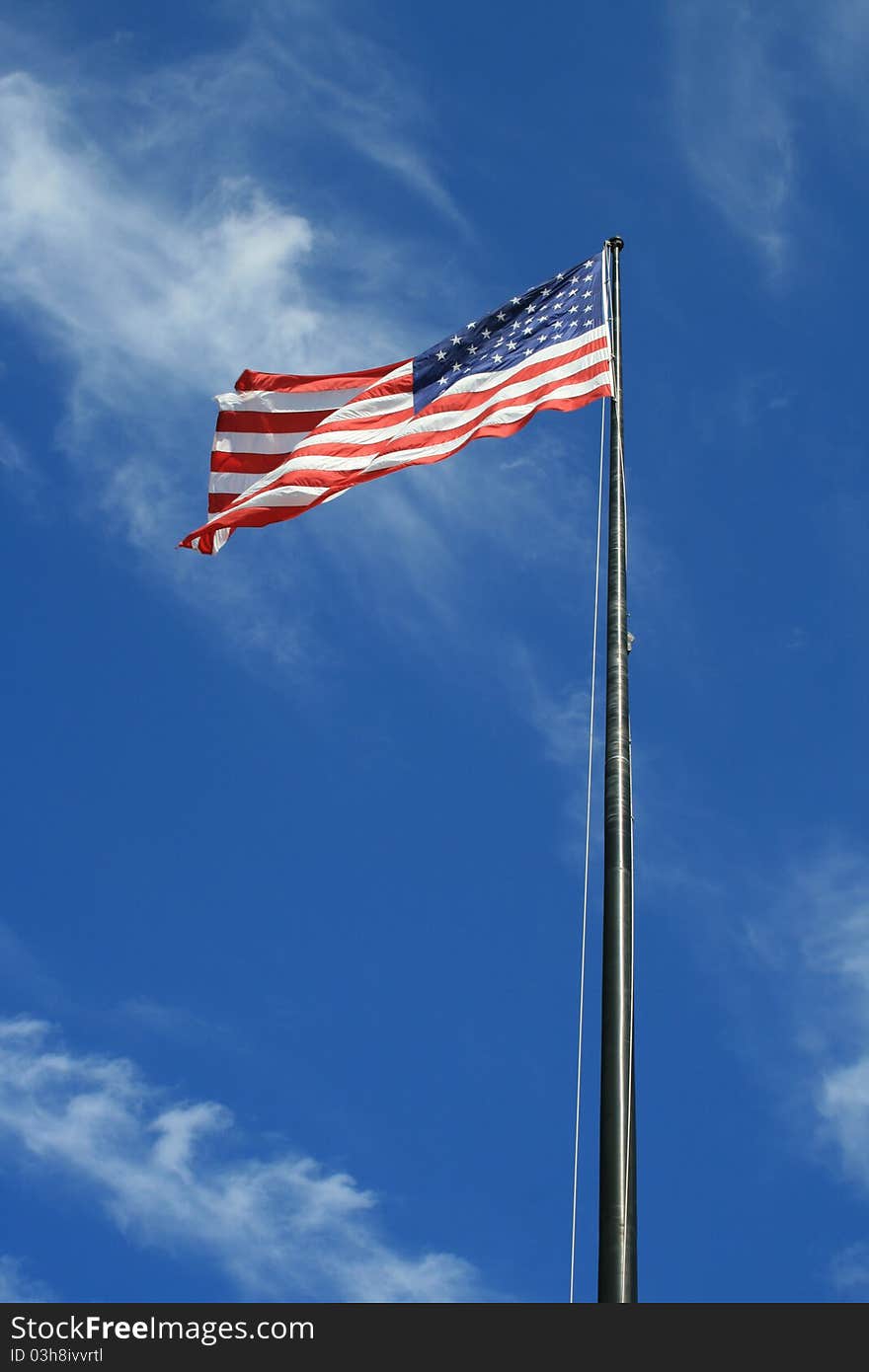 The national flag of the United States of America (the American flag ) consists of thirteen equal horizontal stripes of red (top and bottom) alternating with white, with a blue rectangle in the canton (referred to specifically as the union ) bearing fifty small, white, five-pointed stars arranged in nine offset horizontal rows of six stars (top and bottom) alternating with rows of five stars. The fifty stars on the flag represent the 50 states and the 13 stripes represent the original thirteen colonies that rebelled against the British monarchy and became the first states in the Union.[1] Nicknames for the flag include the Stars and Stripes , Old Glory, [2] and The Star-Spangled Banner (also the name of the national anthem). The national flag of the United States of America (the American flag ) consists of thirteen equal horizontal stripes of red (top and bottom) alternating with white, with a blue rectangle in the canton (referred to specifically as the union ) bearing fifty small, white, five-pointed stars arranged in nine offset horizontal rows of six stars (top and bottom) alternating with rows of five stars. The fifty stars on the flag represent the 50 states and the 13 stripes represent the original thirteen colonies that rebelled against the British monarchy and became the first states in the Union.[1] Nicknames for the flag include the Stars and Stripes , Old Glory, [2] and The Star-Spangled Banner (also the name of the national anthem).