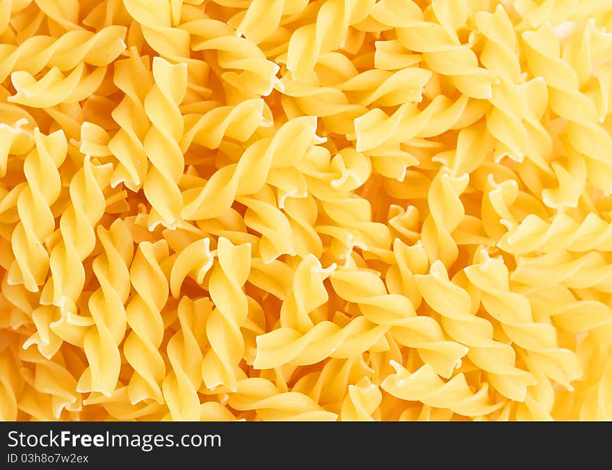 Fusilli swirl pasta forming a background