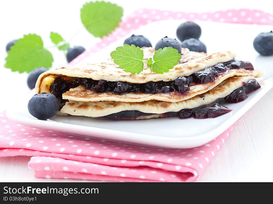 Filled pancake with bilberry jam