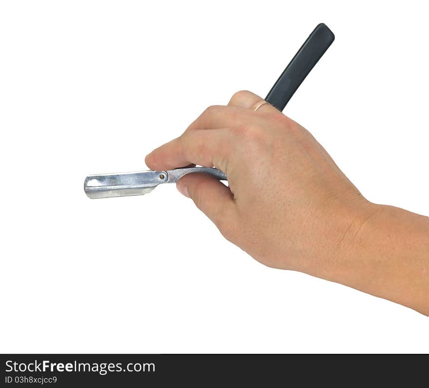 Hand holding classic straight razor on white background