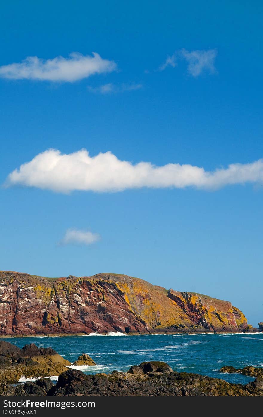 Sea Rocks And Clouds