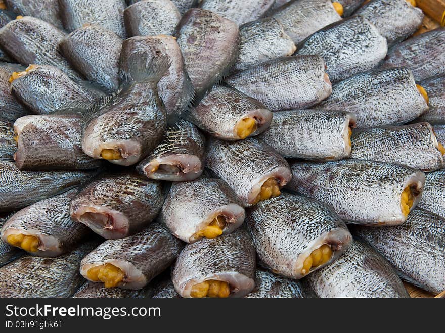 Dry Gourami fish, in a circle on bamboo plate