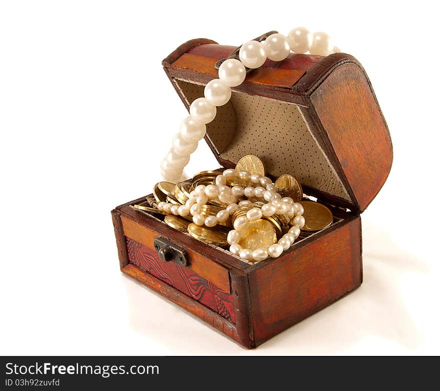 Chest with coins and large pearls isolated on white background