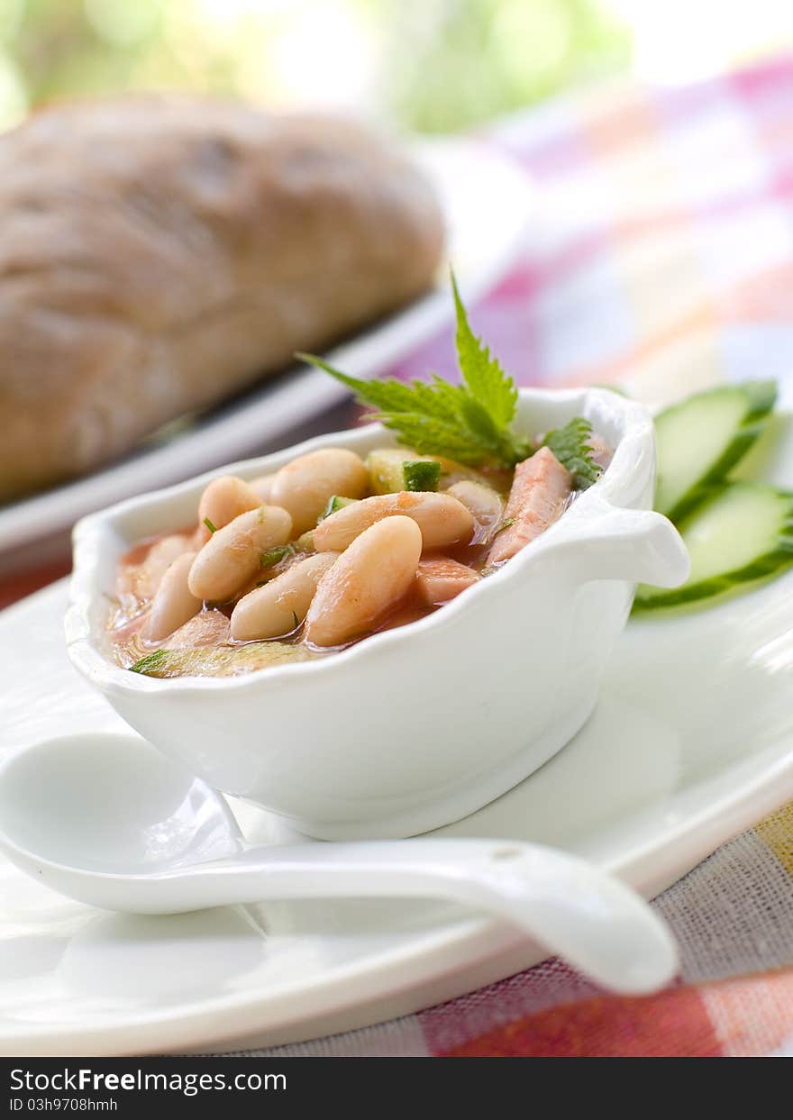 Bowl of vegetable soup with beans. Selective focus