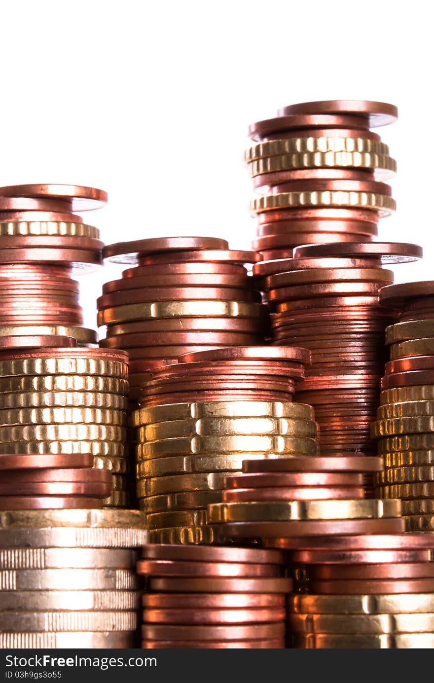 Many coin piles of eurocoins stand side by side