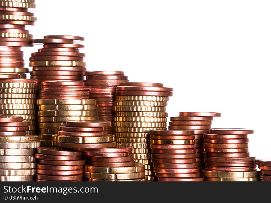 Many coin piles of eurocoins stand side by side