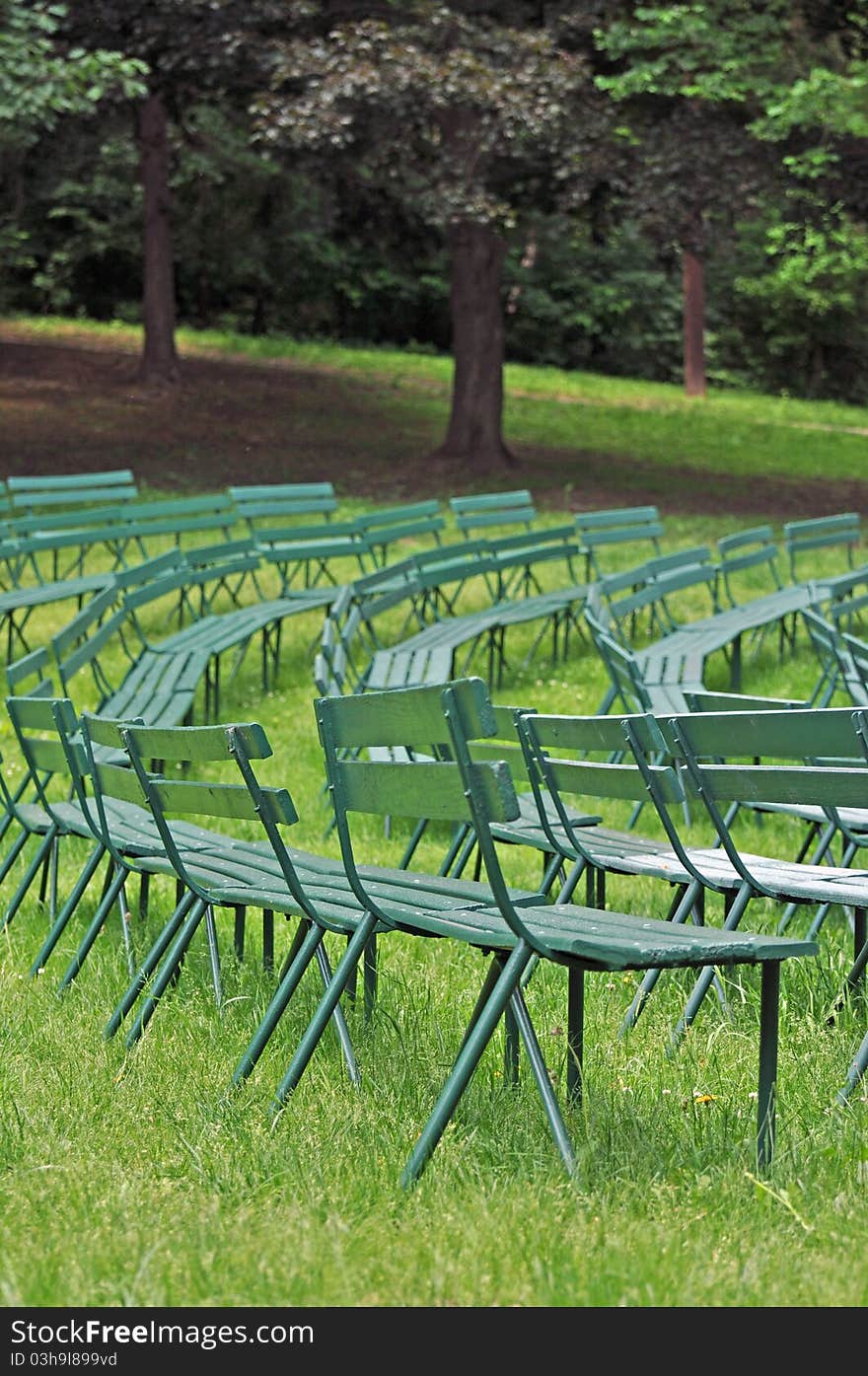 Park benches at the band stand are empty until the next show. Park benches at the band stand are empty until the next show