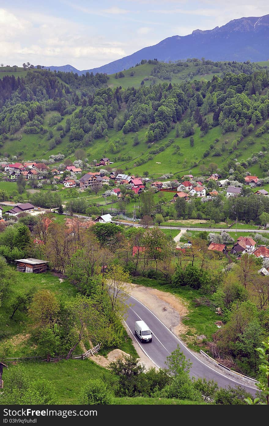 Rural curved road in mountain valley