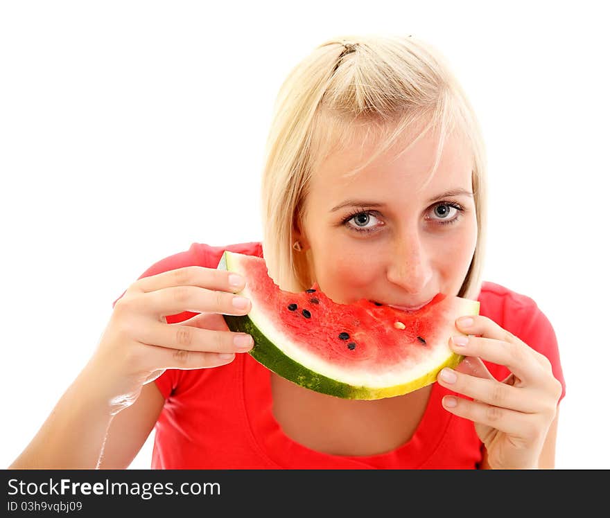 A pretty young girl eating a piece of watermelon. A pretty young girl eating a piece of watermelon