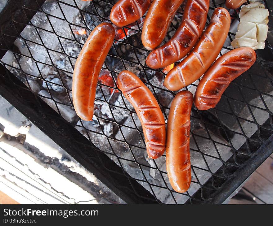 Grilling barbecue with sausages and cheese. Grilling barbecue with sausages and cheese