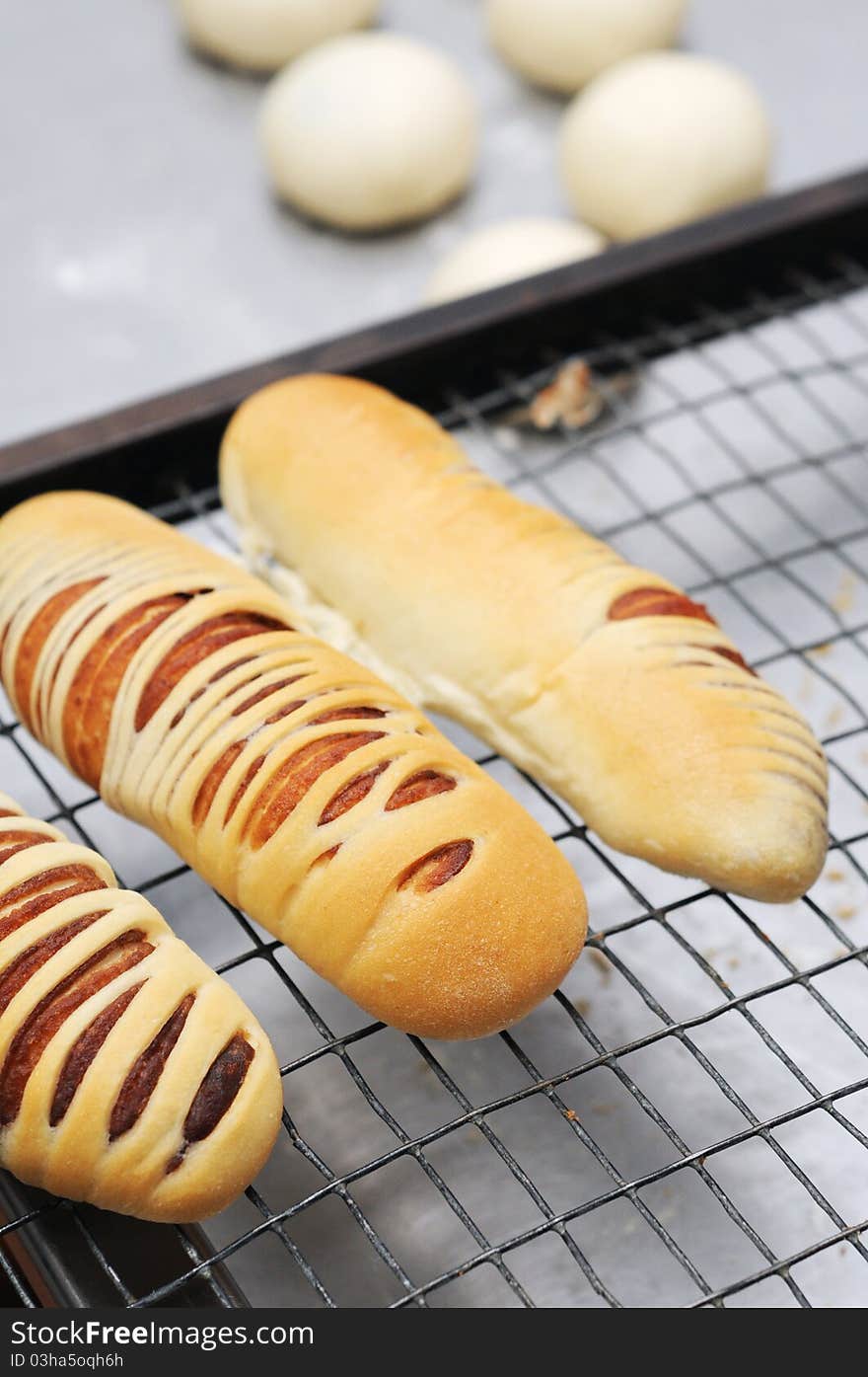 Fresh bread cake on cooler rack isolated ball dough on the kitchen table