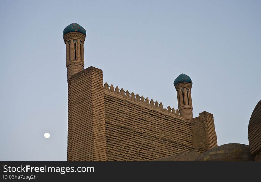 Mosque wall and moon on the background